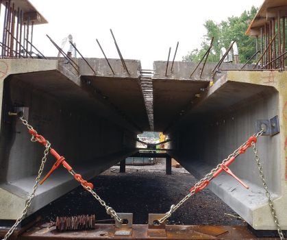 Completed decked beam units in the staging area. The bracing can be seen in the background. Photo: CHA Consulting.