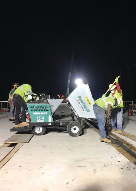 Ultra-high-performance concrete for the closure pour between decked beam units was placed to a level Ã??Ã?Â¼ in. higher than the top of the deck to ensure no low points in the bridge deck. The deck was later ground to remove the overpour and minor undulations. Photo: C.W. Matthews Contracting Co. Inc.